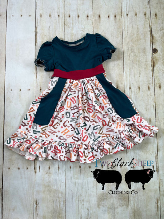 6 Alphabet dress with pockets and ruffle